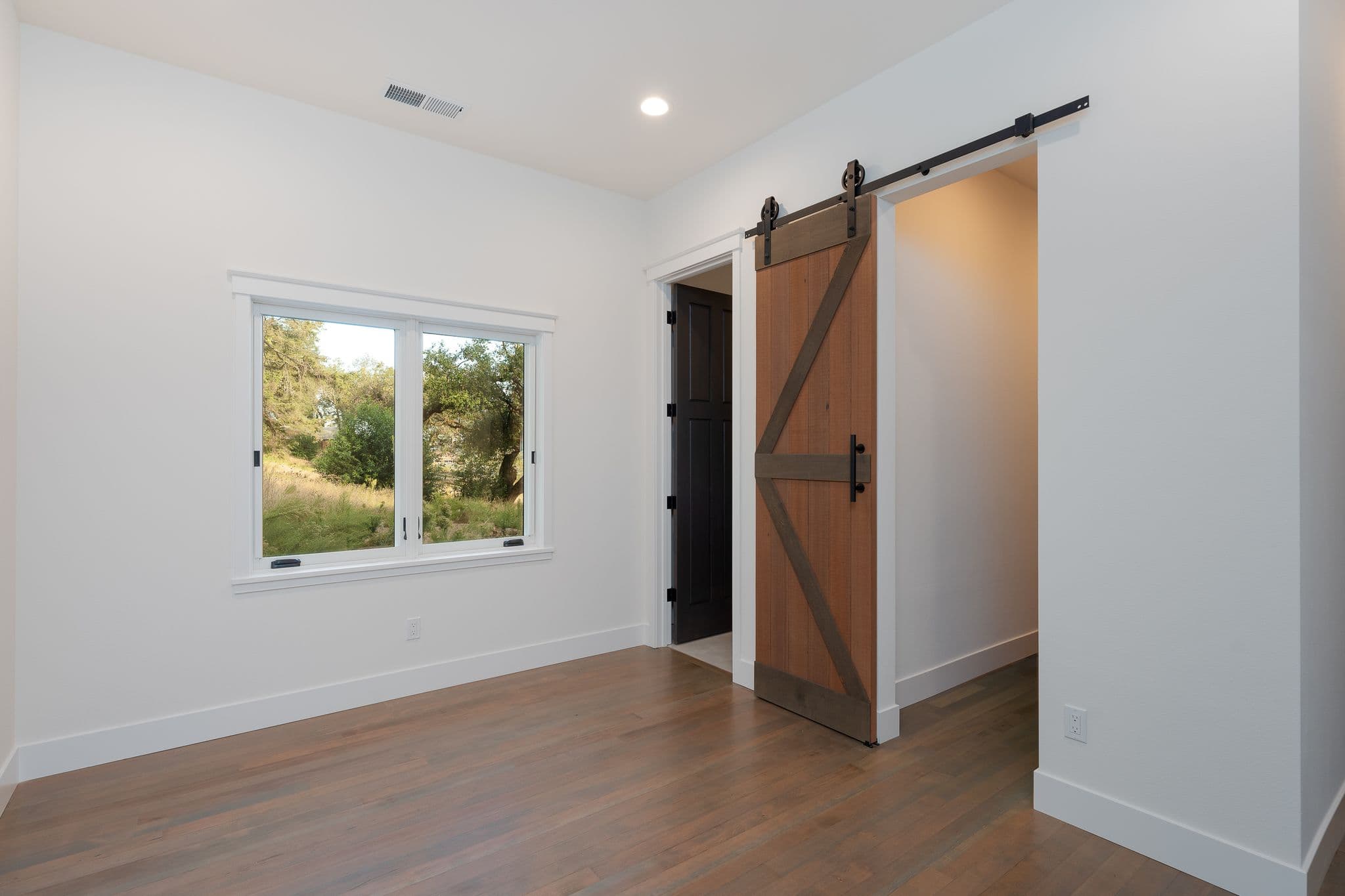 ADU bedroom with barn door