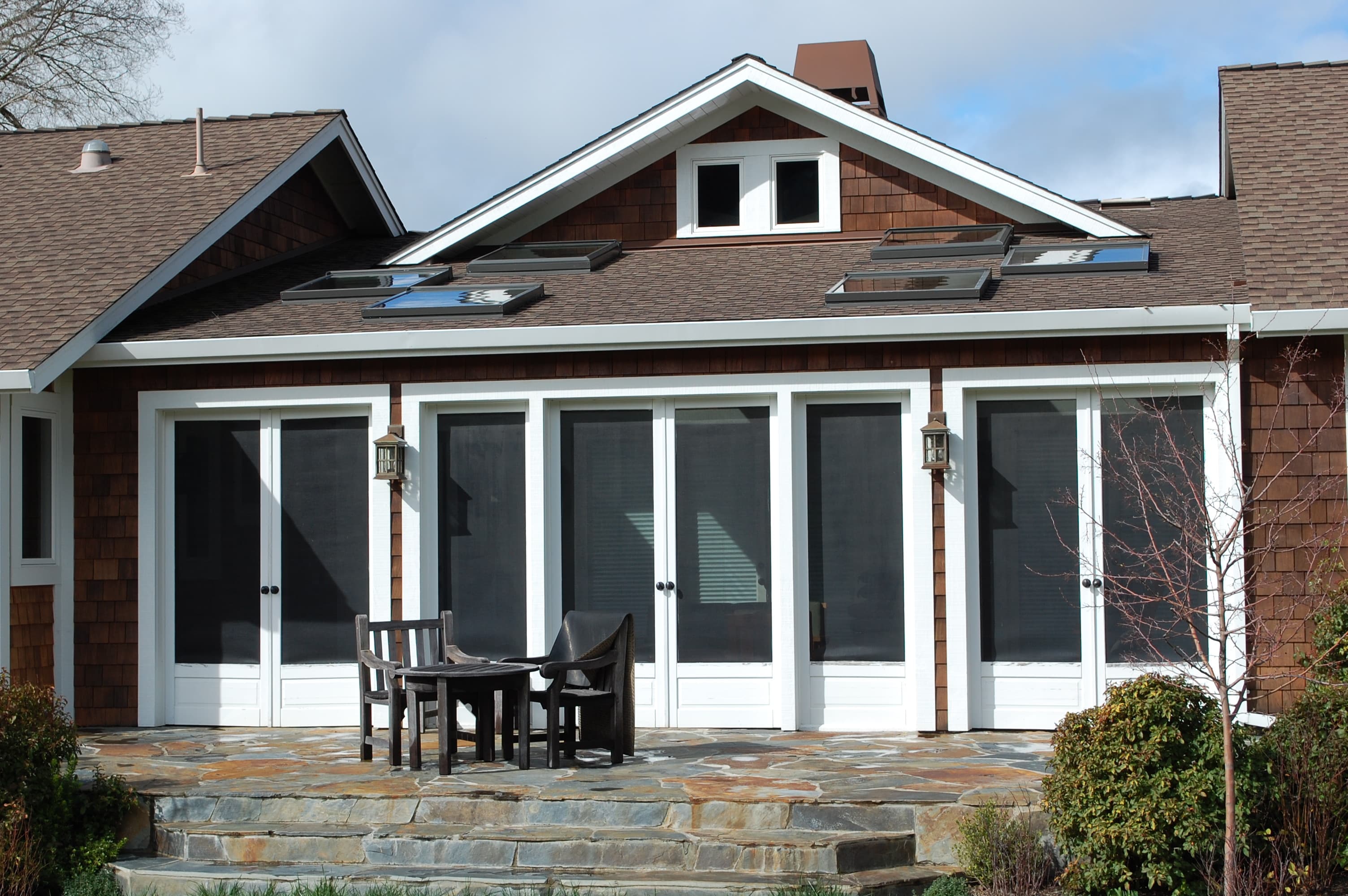 East elevation — patio and sunroom